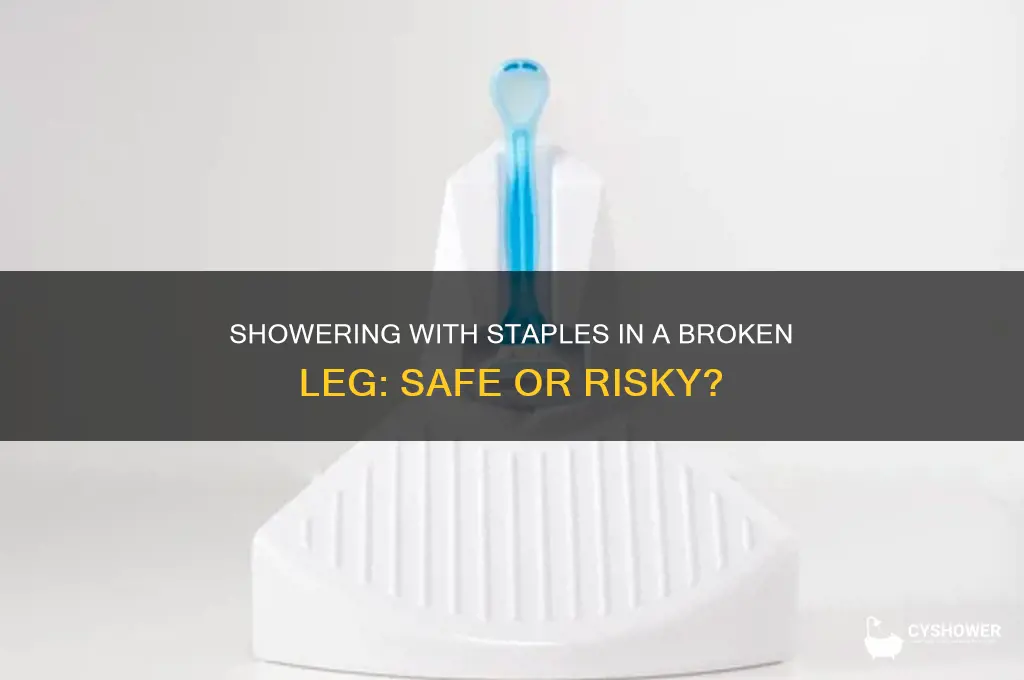 can i shower with staples in my broken leg