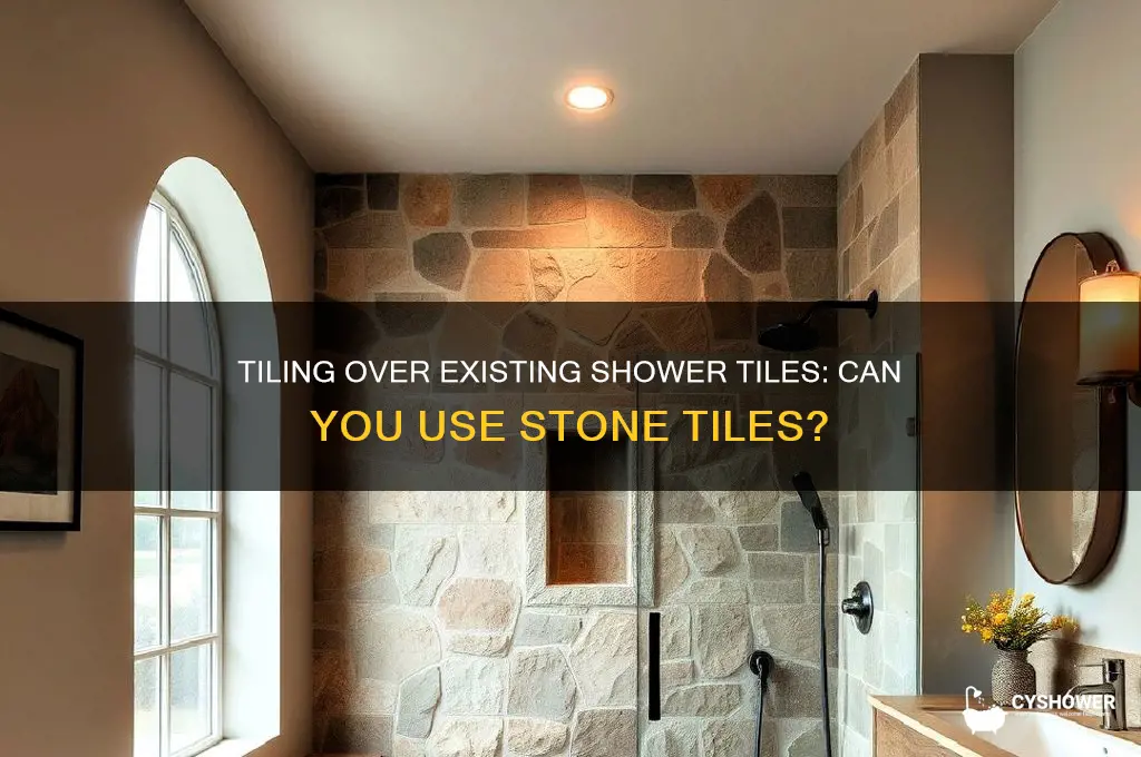 can you tile stones over tile in a shower