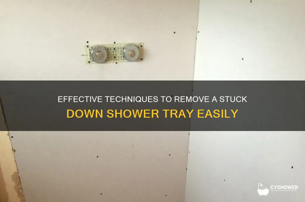 how to remove a stuck down shower tray