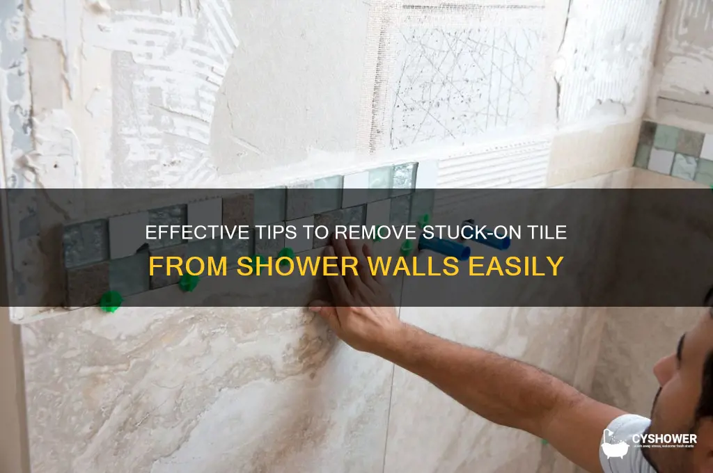 how to remove stuck on til from shower wall