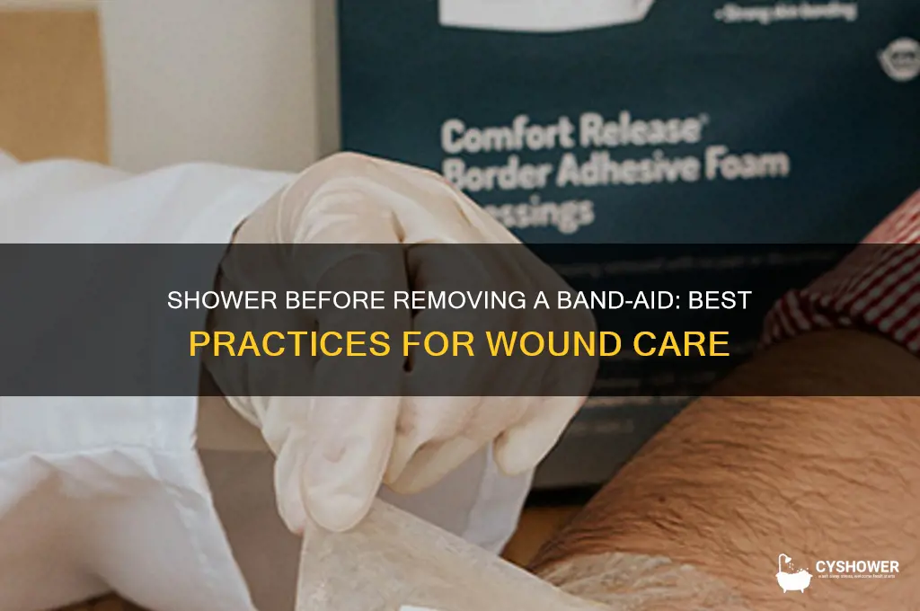 should i shower before i take my band aid off