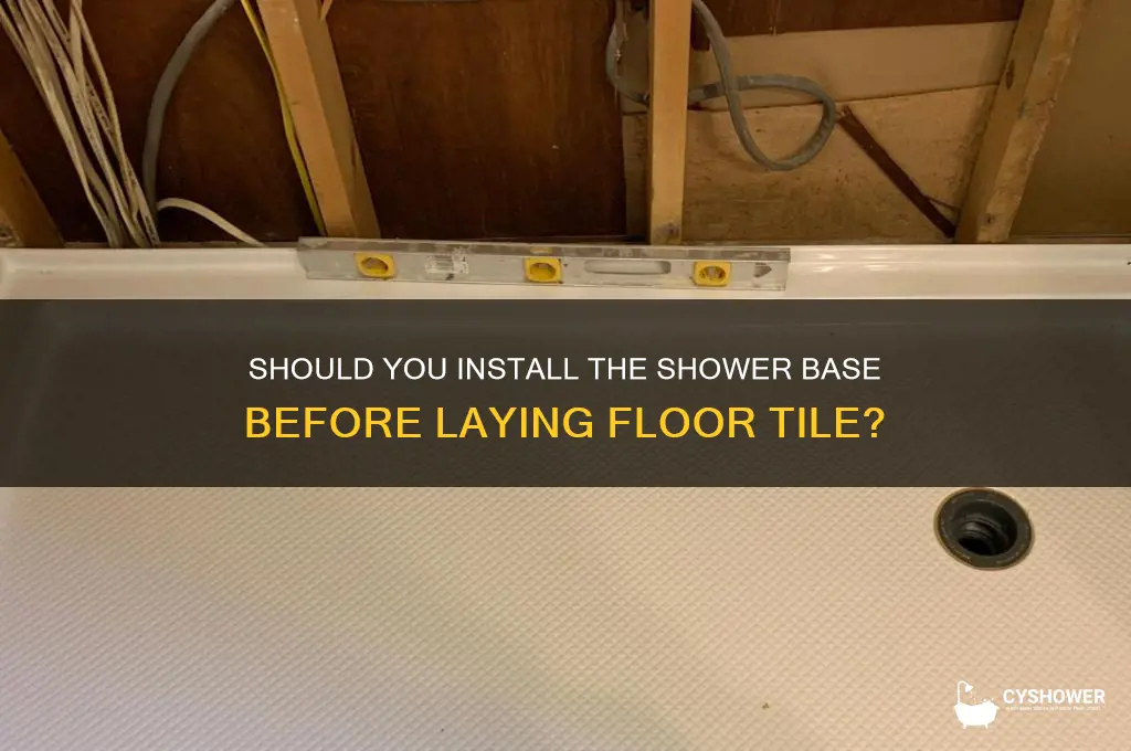 should shower base be set before floor tile