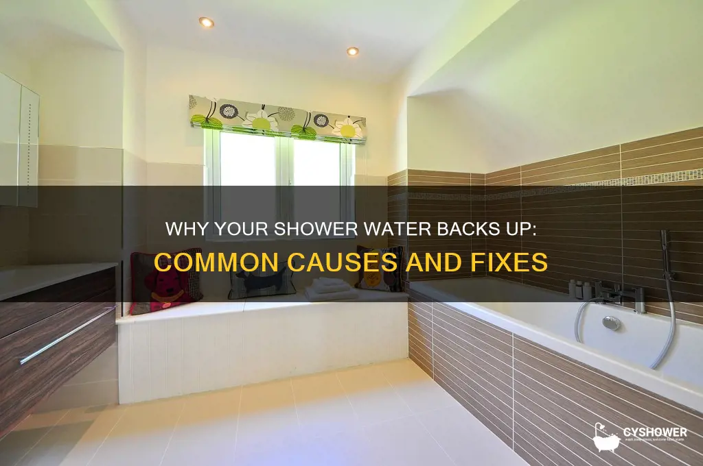 what causes water to back up in shower