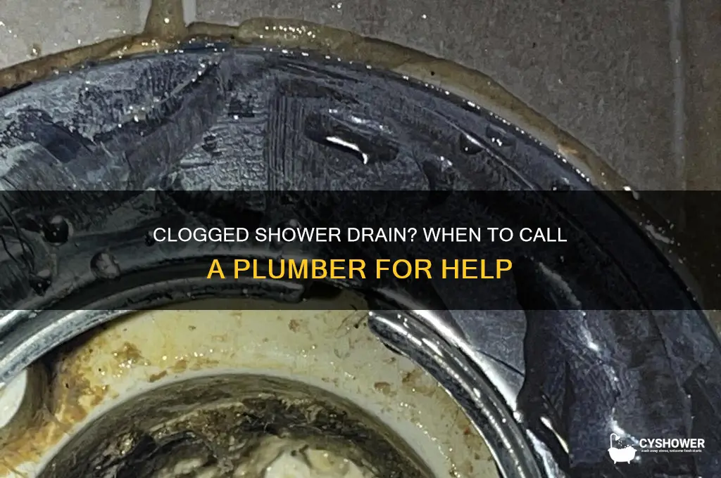 when to call a plumber for a clogged shower drain