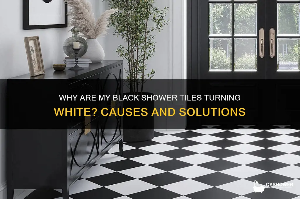 why are my black shower tiles turning white
